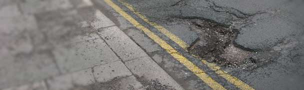 pothole in road double yellow line claim