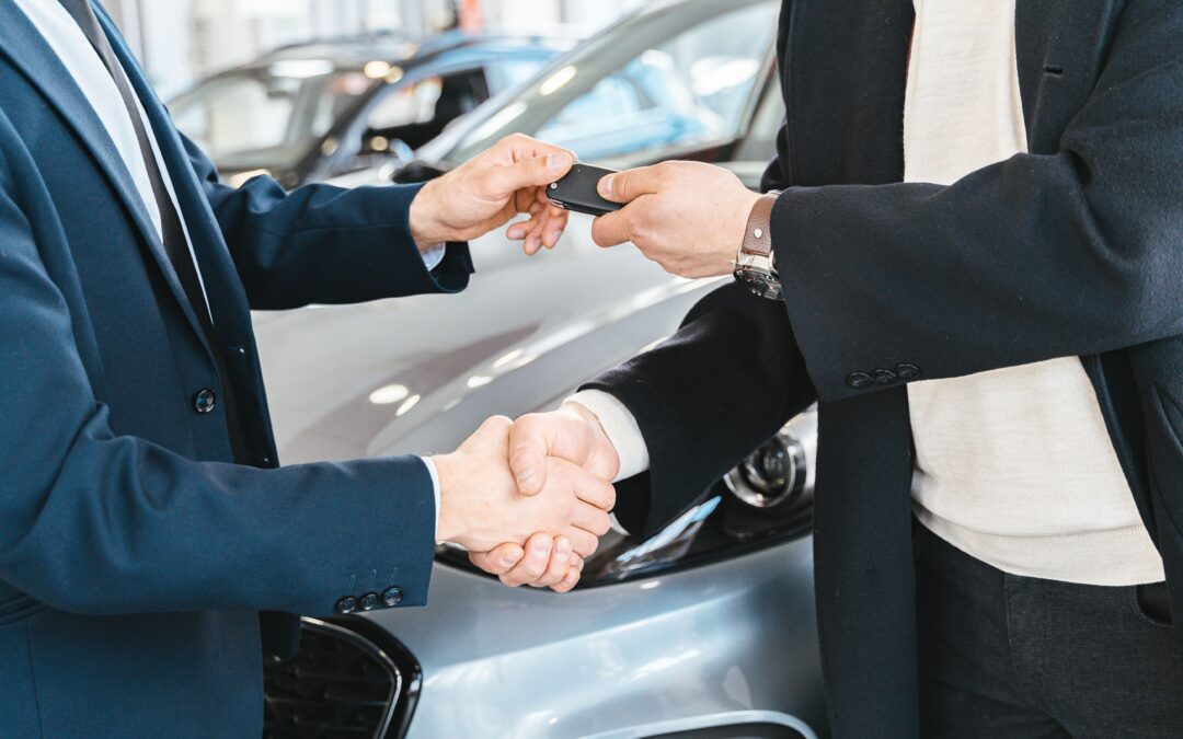 buying a car handing over a key